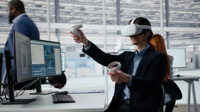 Senior manager using VR technology to optimize microchip production in factory R&D workspace.
