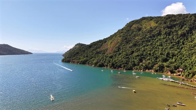 High Angle View of Deep Blue Bay and Forested Hills