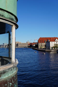 Aged Copper Bridge Structure with Copenhagen Harbour and Warehouses in Background, Denmark