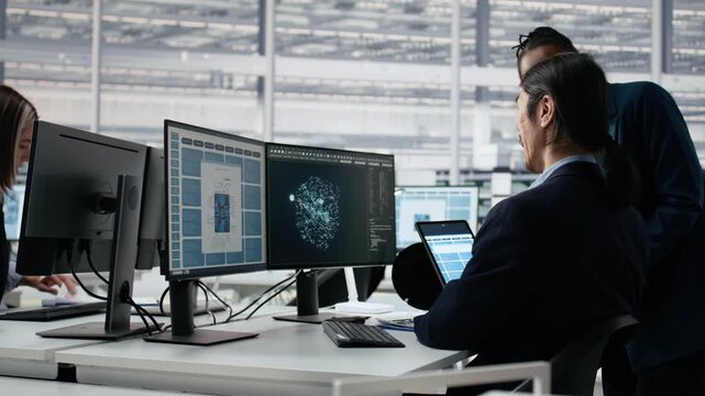 Timelapse of diverse employees working in microchip factory lab with an engineering team.