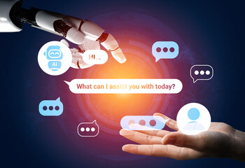 Fototapeta premium A captivating illustration depicting the interaction between a robotic hand and a human hand, showcasing the future of communication and assistance through AI technology. Gantry