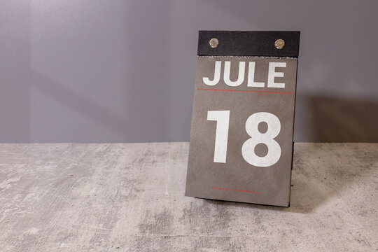 Jule 18 Calendar Date on Desk Monthly Planning, Deadline and Schedule Concept