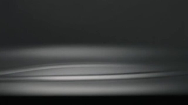 Close Up of Finger Creating Water Ripple