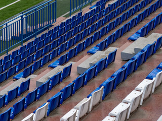 Fototapeta premium Empty blue stadium seats and railings
