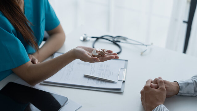 Doctor recommended hearing aids to hearing impaired person