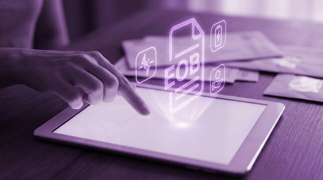 Person reviewing Explanation of Benefits EOB digital document on tablet screen with insurance and medical billing icons in modern office setting.