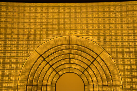 Glass block to decorated to wall and cuve of door that interior of the building.