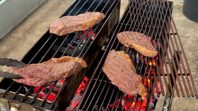 Grilling beef sliced on Charcoal stove.