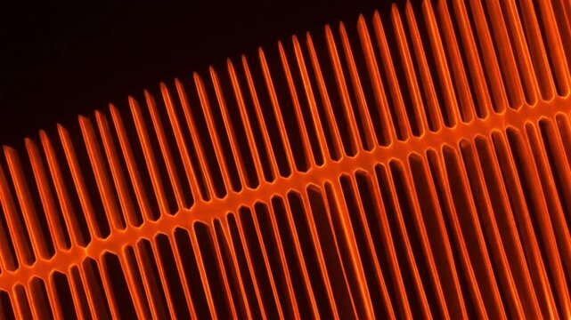 ネオンオレンジのチューブ状膜が幾何学的な剛体プレート構造へと変化する物理シミュレーションCG