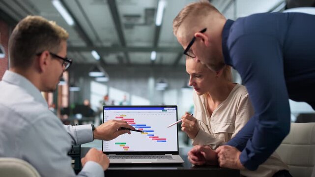 Project Manager Leads Diverse Team Reviewing Gantt Chart Schedule