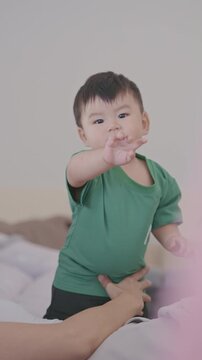 Cute Asian Toddler Looking at Camera Indoors, Adorable Child Portrait and Family Lifestyle in 4K