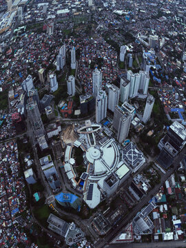 Cebu City, Philippines - 15 November 2025: Aerial view of Ayala Center Cebu and surrounding skyscrapers in the business district under a cloudy sky.