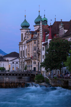 Lucerne cityscape with Jesuit Church and Reuss River at twilight