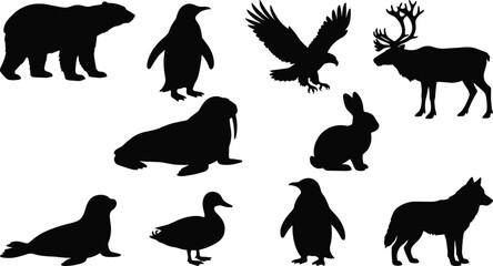 Collection of arctic and northern wildlife silhouettes featuring polar bear penguin eagle deer walrus seal rabbit and wolf shapes © MdMonowar