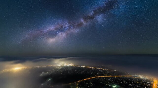 Milky Way Galaxy and City Lights Above the Fog 4K Generative AI