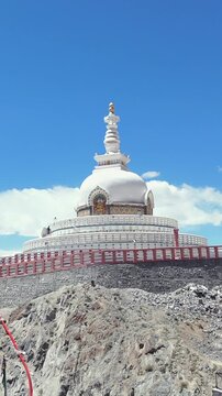 Vertical Aerial View of Shanti Stupa with Himalayan Mountains in Leh Ladakh India