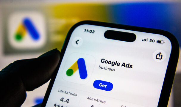 Closeup of a smartphone screen displaying the google ads application page in the app store