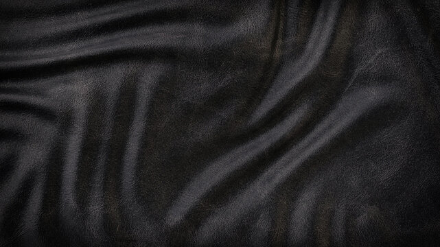 Black luxury wrinkled folded leather texture background.