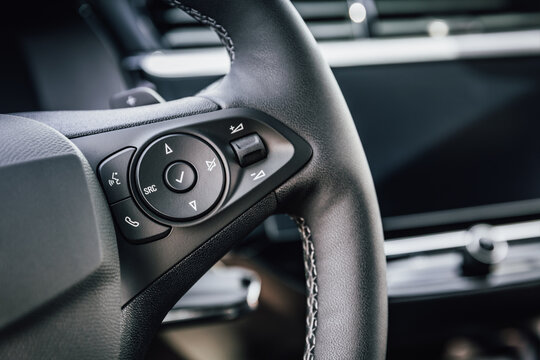 Modern car steering wheel with integrated controls for audio and calls