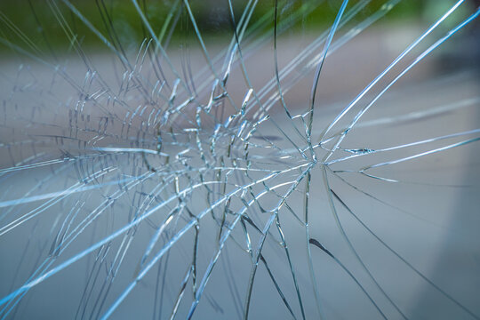 Crime prevention and vandalism concept. Broken display window of a shop.