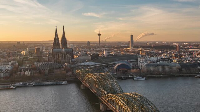 Cologne (Koln) Germany time lapse day to night high angle view city skyline at Cologne Cathedral (Cologne Dom) with Rhine River and Hohenzollern Bridge