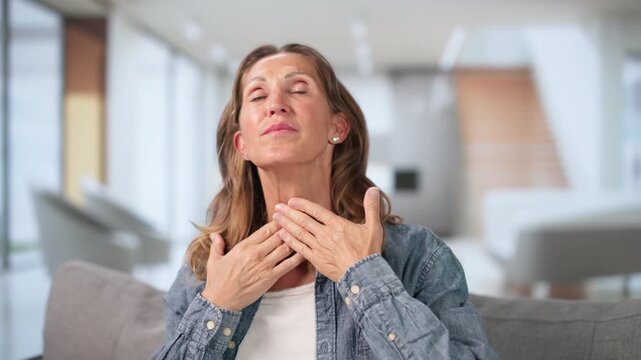 Older Woman Sitting Thoughtfully At Home