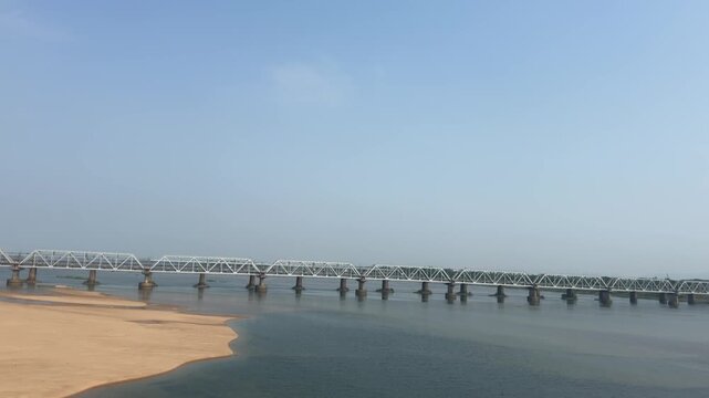 Mahanadi Railway Bridge Spanning River and Sandbanks in Odisha, India