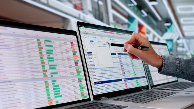 Medical Coder Carefully Reviews Billing Codes On Laptop