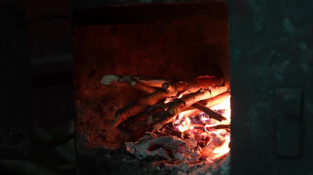 Blacksmith Adding Wood To Forge Fire Close Up