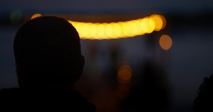 Dusk duet on a small lakeside dock stage