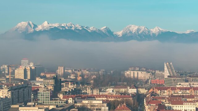 Ljubljana Slovenia time lapse city skyline and Kamnik Savinja Alps mountain range