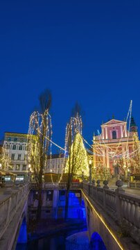Ljubljana Slovenia time lapse night to day Christmas market at Preseren Square (Presernov trg) (vertical)