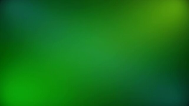 A soft, blurred abstract background featuring various shades of green with subtle light gradients and bokeh effects.