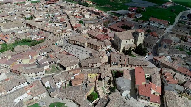 Aerial view of historic town center in Astudillo with central church