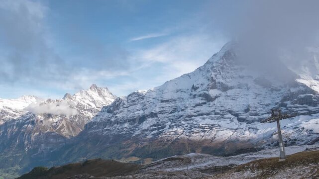 Nature landscape time lapse of Swiss Alps mountain range at Eiger peak and Mannlichen cable car