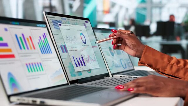 Financial Analyst Reviewing Market Trends On Laptop
