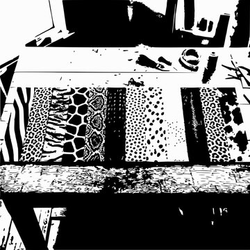 Animal print fabric samples on wooden table, craft and sewing concept
