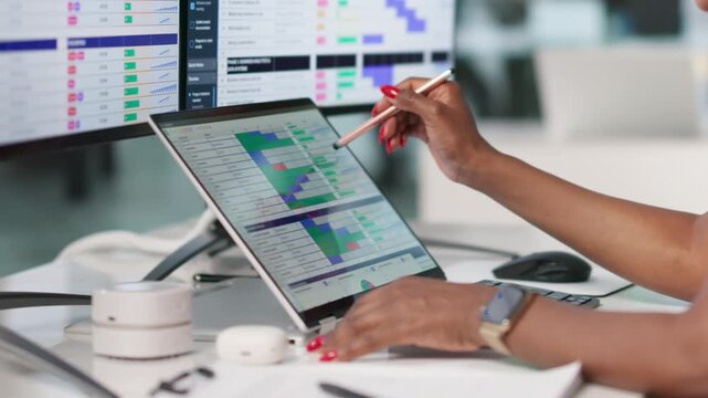 Medical Biller Carefully Reviews Codes On Laptop