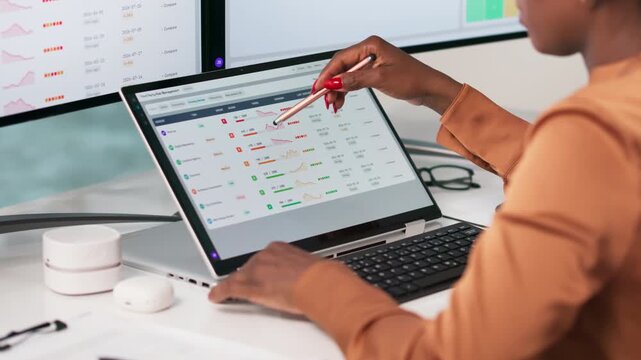 Risk Manager Reviewing Supplier Data On Laptop