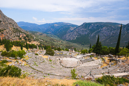 Ancient Delphi theatre ruins with Mount Parnassus views