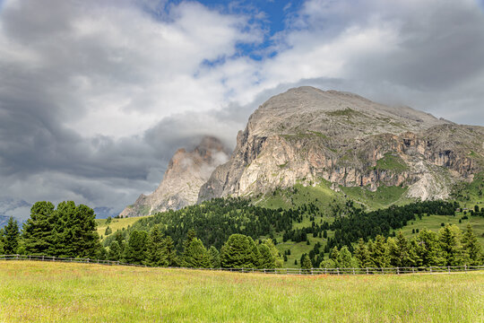 Clouds over the Langkofel group with the peaks of Langkofel and Plattkofel on the Seiser Alm, Dolomites, South Tyrol, Italy.