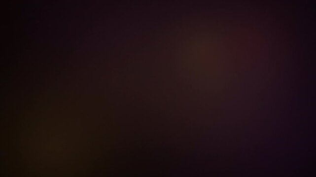 Moody Deep Umber Analog Grain Texture Featuring Organic Shifting Amber Glow and Retro Flicker for Cinematic Title Sequence Background 4k video