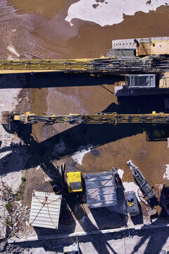 Wormerveer, Netherlands - 28 April 2026: Aerial view of heavy hydraulic demolition machinery with long beams at the former Meneba flour mill site during Zaankwartier redevelopment.