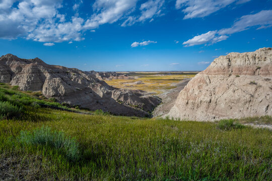 Badlands Canyon Landscape Under Dramatic Cloudy Sky in Badlands NP