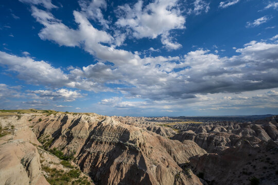Badlands Canyon Landscape Under Dramatic Cloudy Sky in Badlands NP