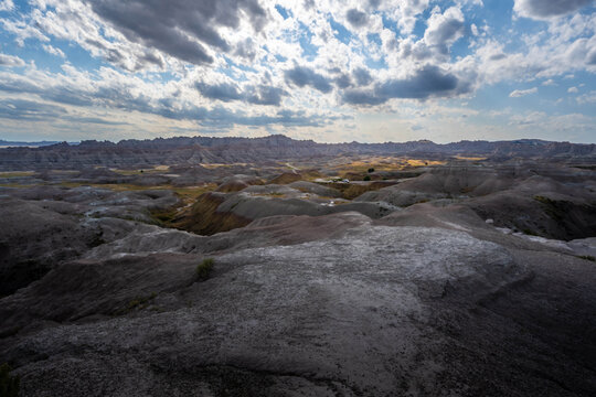 Badlands Canyon Landscape Under Dramatic Cloudy Sky in Badlands NP