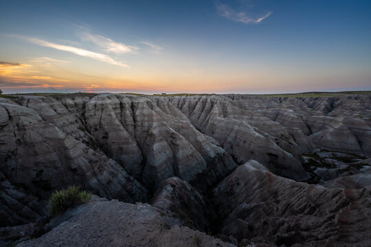 Badlands Canyon Landscape Under Dramatic Cloudy Sky in Badlands NP