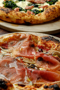 Texture of pizza with ham salami prosciutto close-up