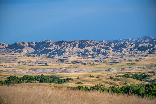 Badlands Canyon Landscape Under Dramatic Cloudy Sky in Badlands NP