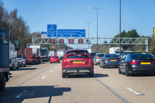 British road transport, driving on the M25 motorway, with signs to Heathrow airport